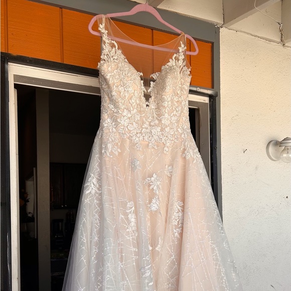 Wedding dress
Wore Once
Size 12
Style J6704 Moonlight from Just Right Bridal - Picture 2 of 3